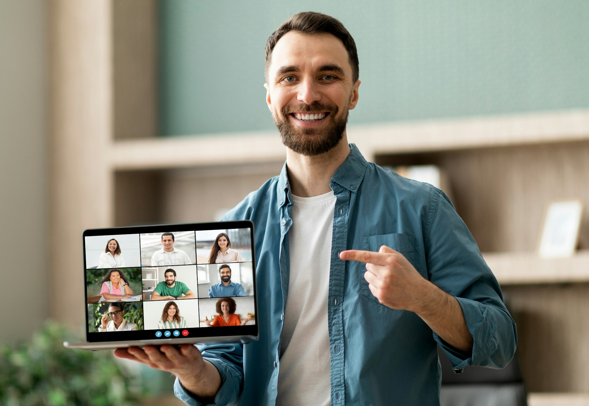 Man Holding Laptop Showing Group of People, Telecommunication Concept